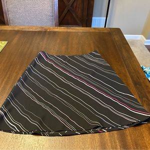 Black Express skirt with multi-colored diagonal stripes